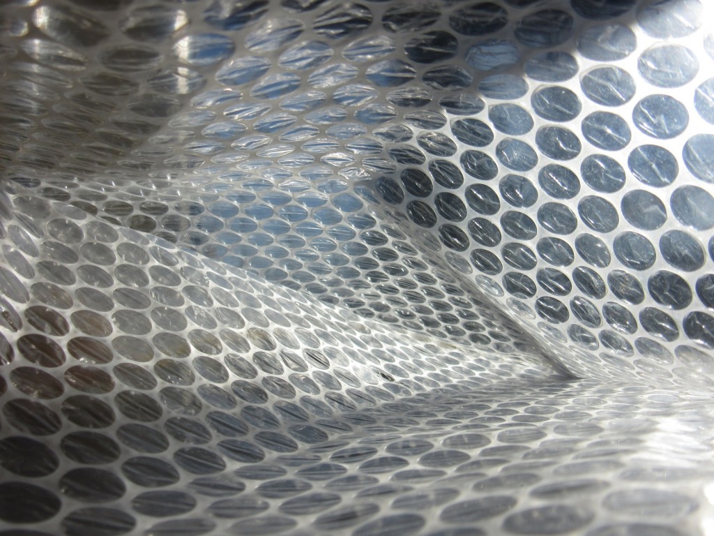 Bubble wrap not only takes up significant volume, it's also an unnecessary expense. Simply use shirts or towels that you're already planning to pack to wrap your delicate items.